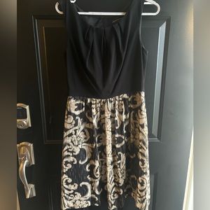 Knee length sleeveless dress.